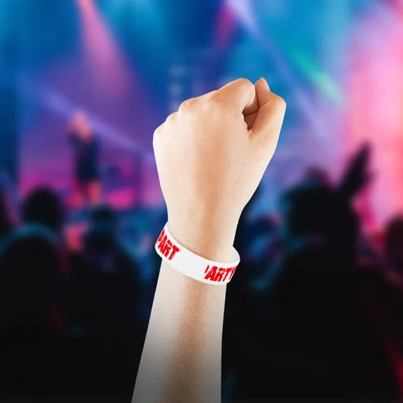 Dancer on stage wearing an event wristband